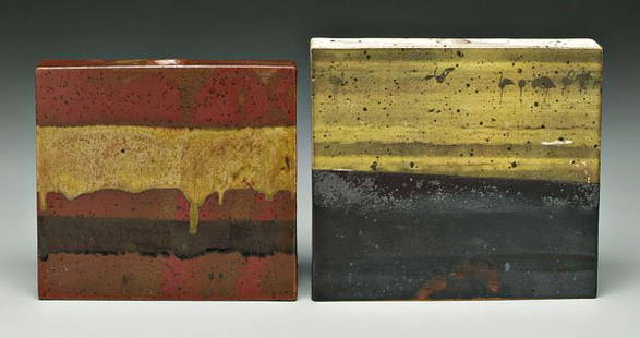 Two Wyman pottery book vases: (William Wyman, American, 1922-1980): one rectangular, yellow offset print above black glaze with row of flamingos at top, base marked "Wyman 70", 9 x 10-1/8 x 1-7/8 in.; one with bands of runny brick