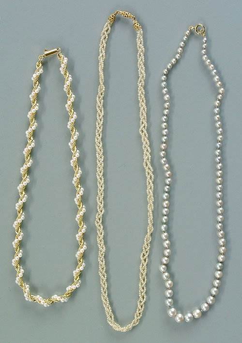 Three pearl necklaces: 14 kt. yellow gol