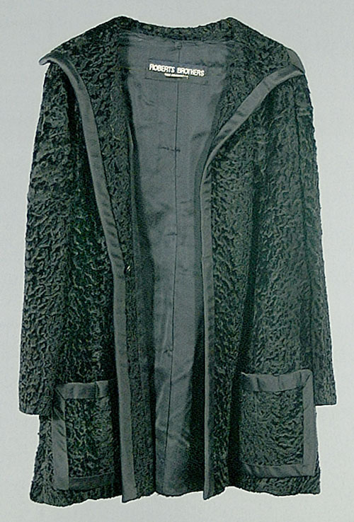 Mid-length black Persian lamb coat, sat