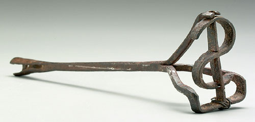 Iron brand shaped as dollar sign, one en