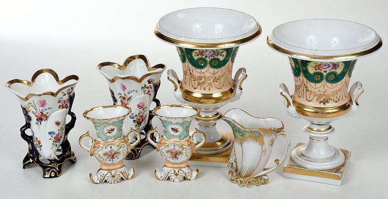 Seven Pieces Paris Porcelain Garnitures: French, 19th century, pair two handled urns, gilt floral decoration, square bases, 10 in.; pair cobalt and floral spill vases; 6-1/4 in.; Jacque Petit three piece garniture, scrolled bases, marked "J.