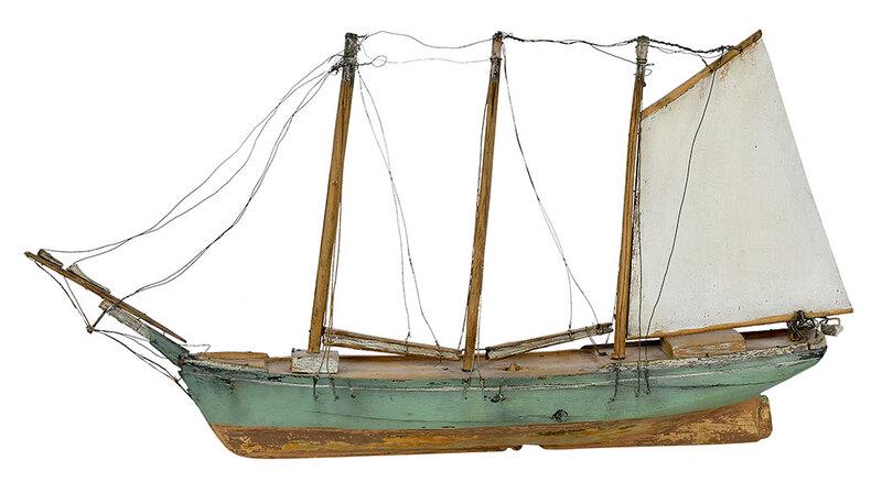 A Carved and Painted Wooden Ship Model: American, 19th/20th century, model of a three masted sailing vessel with single wood sail, the hull painted pale green and the underside painted yellow, with wire fittings, 26 x 13 in.ÿ, Provenance: