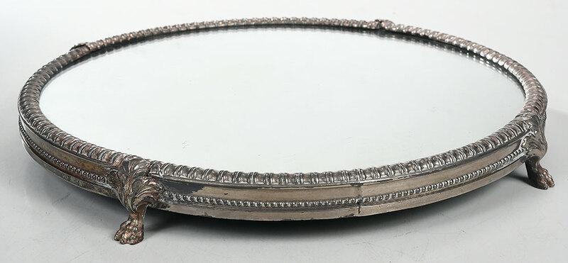 Silver Plated Mirror Plateau: probably American, early 20th century, circular, four paw feet,ÿunmarked,ÿ16 in.ÿ, Provenance: Estate of Aubrey Hancock, Charleston, South Carolina