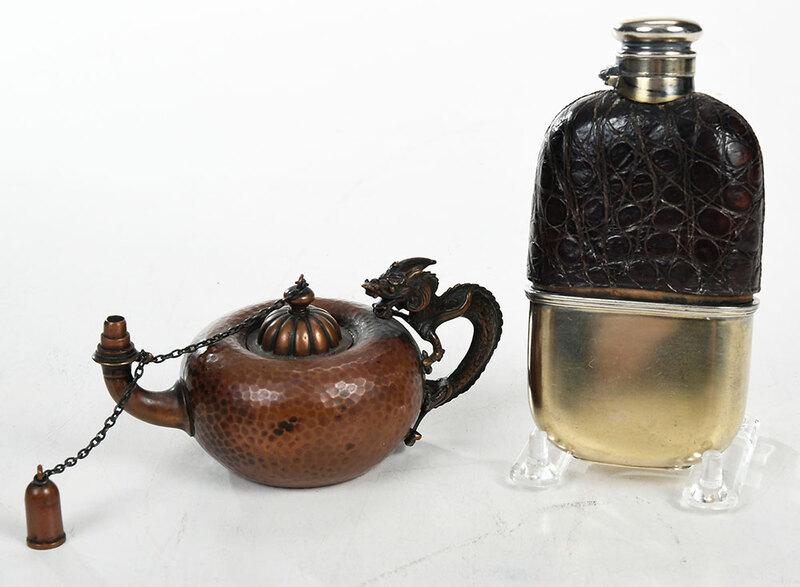 Hammered Copper Cigar Lighter, Flask: 20th century includingÿAmerican, Asian style copper hammered finish cigar lighter with dragon handle, marks for Gorham, 2-3/4 x 5 x 3 in.;ÿEnglish glass flask with silver-plate lid and cup, and leat