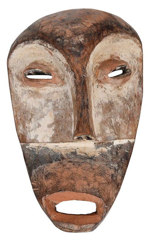 African White Spirit Mask: Lega or Lega style, elongated, slightly asymmetrical face, carved wood, kaolin, pigment, 10-1/4 x 6-1/8 x 3 in., Provenance: Property from the Collection of the Late Parker B. Poe, Thomasville, Georgi