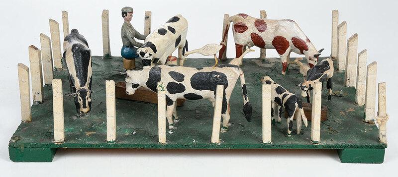 Folk Art Carved and Painted Cow Yard: American, early 20th century, wooden model farm yard with a figure milking a cow, other cows grazing with birds, unsigned, 6 x 8 x 12 in., Provenance: A North Carolina Private Collection