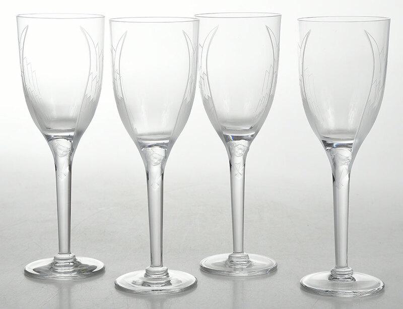 Set of Eight Lalique Angel Champagne Flutes: French, 20th century, clear and frosted glass with molded angel mask and engraved wings, markedÿ"Lalique France", 8 in.ÿÿ, Provenance: Estate of James E. Meyer, Charlotte, North Carolina