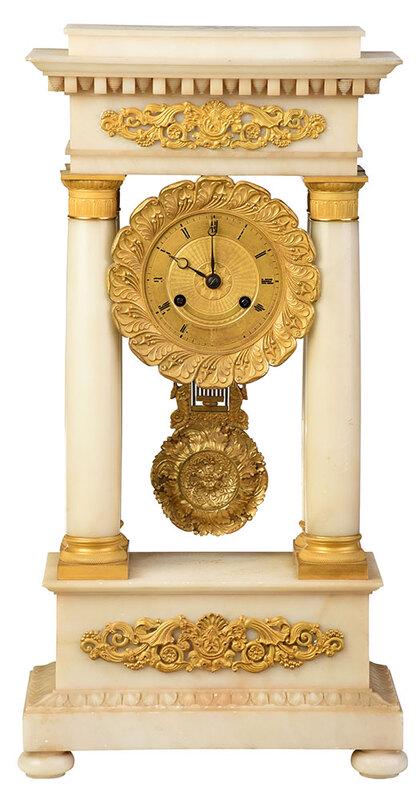 French Empire Gilt Bronze, Marble Portico Clock: 19th century, gilt bronze mounted white marble mantel clock, stepped cornice supported on four Doric columns flanking a gilt dial with Roman numerals, movement marked "T.&C.", with pendulum and winder