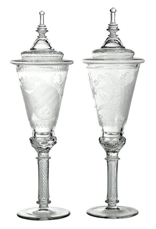 Pair of Engraved Glass Pokals with Coat of Arms: Continental, probably 19th century, lidded goblets each engraved with a coat of arms below a crown, surrounded by floral clusters, white twisted cane stem, 15-3/4 in. with lidsÿÿ, Provenance: Proper