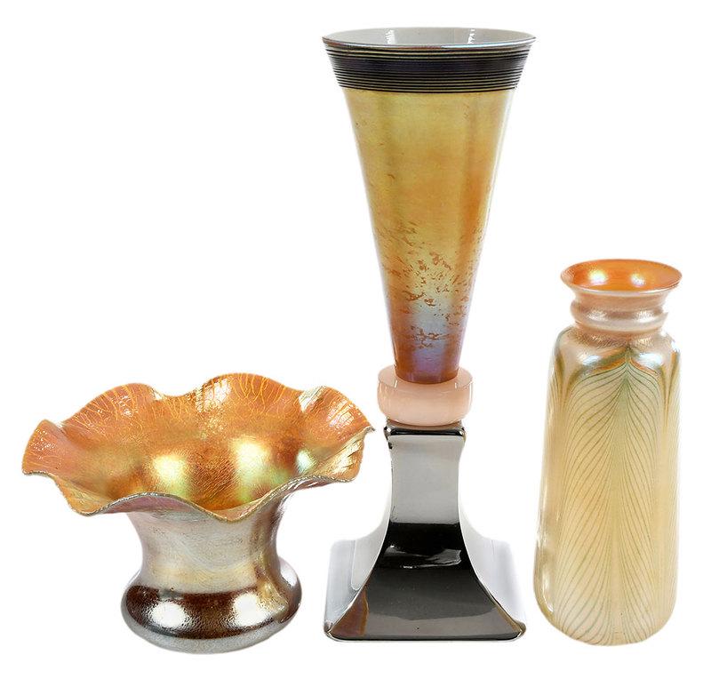 Kew-Blas and Two Steuben Aurene Art Glass Vases: American, 20th century, cylindrical vase with green pulled feather decoration, marked "Kew-Blas" to base, 7-3/4 in.; gold aurene vase with ruffled rim and stretch marks, marked "Steuben Aurene" and "3