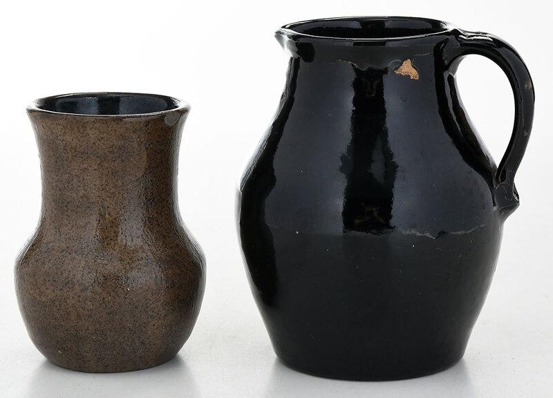 Two Pieces Bachelder Pottery: (Oscar Louis Bachelder, b. 1852 Menasha, Wisconsin, d. 1935 Luther, North Carolina) black glazed pitcher, 7-1/2 in.; rare brown speckle glaze vase, black interior, 5-3/4 in., both with "OLB" monogram 