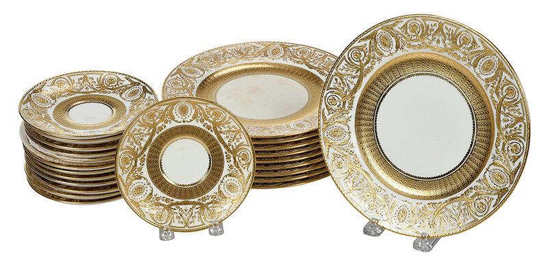 23 Tiffany Minton Gilt Decorated Plates: British, 20th century, 10 dinner plates, 8-3/4 in.; 13 dessert plates, 5-1/2 in.; rims decorated with raised gilt swag and floral designs, marked "Minton / Tiffany & Co. / New York / Made in England"�