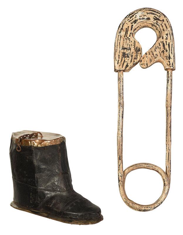 Two Folk Art Trade Signs, Boot and Safety Pin: late 19th/early 20th century, large leather half boot, with wooden sole and riveted copper top, chain attached for hanging, 11-1/2 x 18 in.; finely carved wood safety pin with old white paint decorati