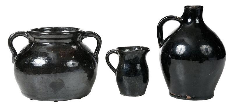 Three Pieces of Bachelder Pottery: (Oscar Louis Bachelder, b. 1852 Menasha, Wisconsin, d. 1935 Luther, North Carolina) brown and black speckle glazed bean pot and creamer, 5-3/4 in., and 4 in.; black glazed jug, 7-3/4 in., all with "OL