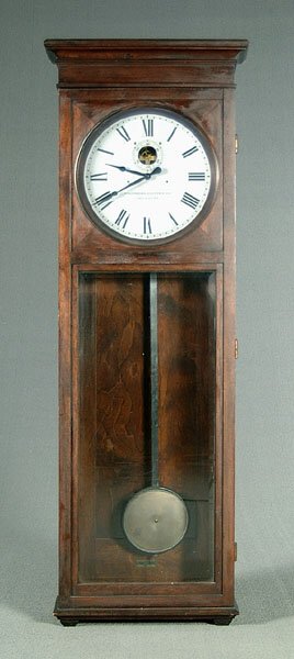 Mahogany Stromberg tall-case clock,: marked "Stromberg Electric Company, Chicago, USA" on face, brass label on top "Master Clock…Chicago," patent dates 1909 through 1915, Roman numerals with second hand, beveled glass door, formerly ba