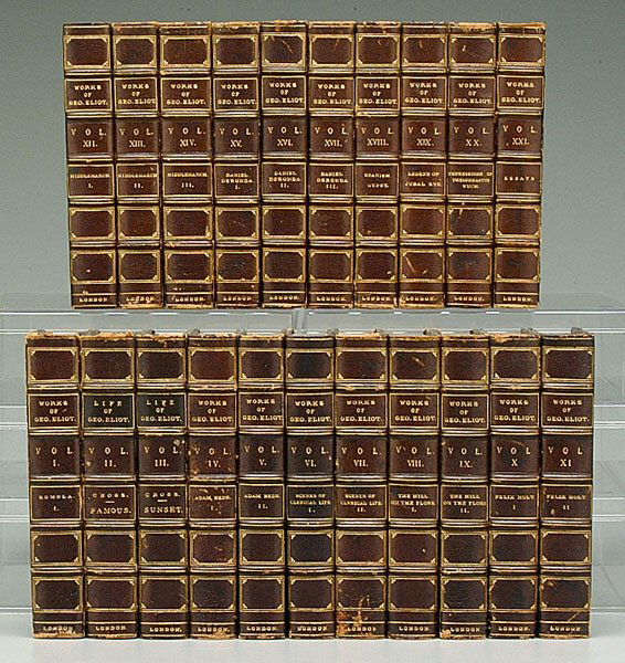 Leather-bound books, George Eliot,: 21 volumes, "Works of Geo. Eliot," William Blackwood & Sons, Edinburgh and London, brown leather three-quarter bindings, marbled panels, raised spine labels with gilt decoration, corners and spines wi