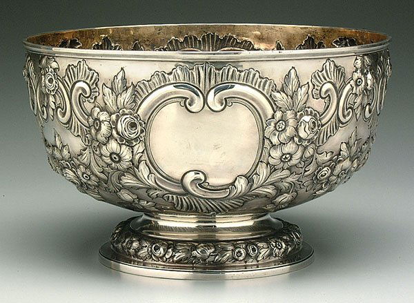 English silver footed center bowl,: heavy relief floral repoussé with two open cartouches, conforming base with floral ring, maker Charles Stuart Harris, marks for London, 1898, 59.16 oz.T., 8-1/2 x 14"