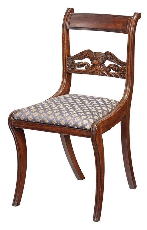 Classical Mahogany Eagle Back Side Chair: New York, 1810-1820, possibly shop of Duncan Phyfe, with spread wing eagle slat over leaf and scroll carved devices, on molded saber legs, with period slip seat, 33-1/2 in. (overall height), 18 in. (s