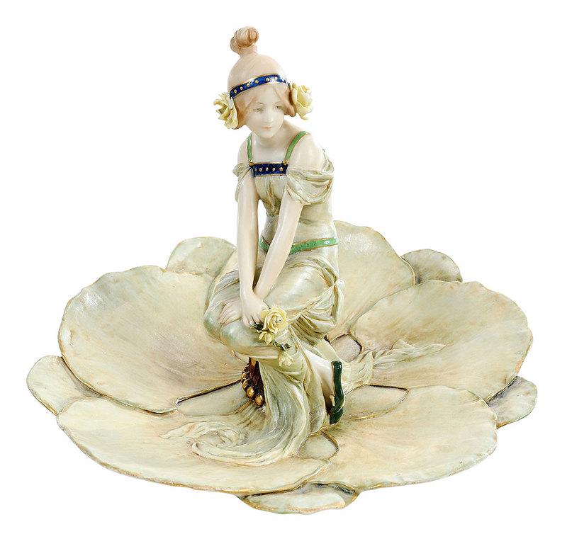 Ernst Wahliss Amphora Figural Centerpiece: Austrian, late 19th century, seated figure of young woman on overlapping lily pads leaves, impressed mark on bottom, "Made in Austria/Ernst Wahliss/Turn-Teplitz", "27/4576" and possible accession numb
