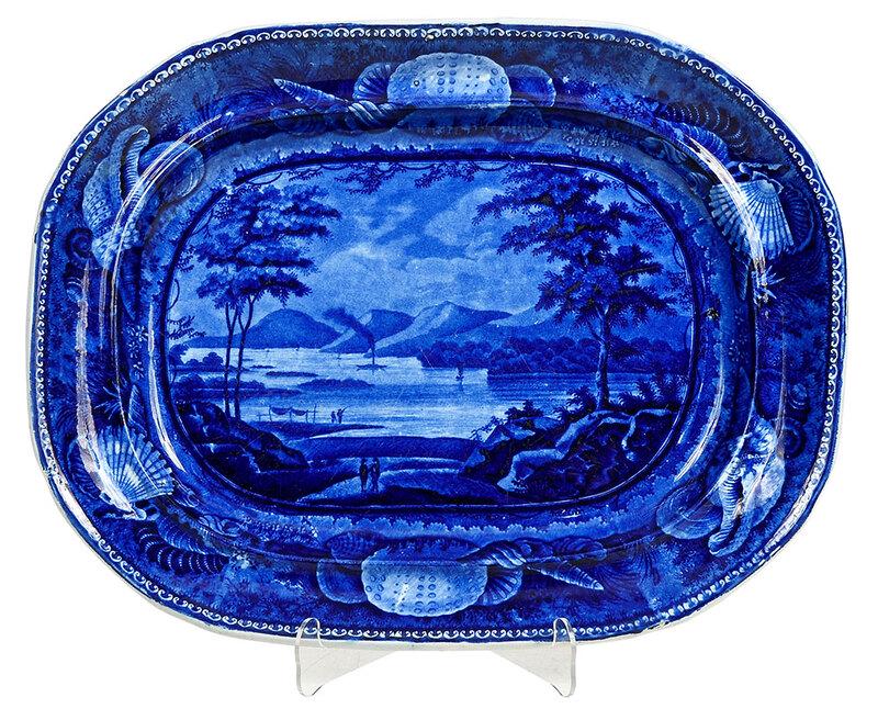 Historical Blue Staffordshire Platter, New York: British, 19th century, blue image transfer of Lake George, seashell border, with underglaze blue printed backstamp containing title, faint impressed mark "E. Wood & Sons Burslem Warranted" in a medall