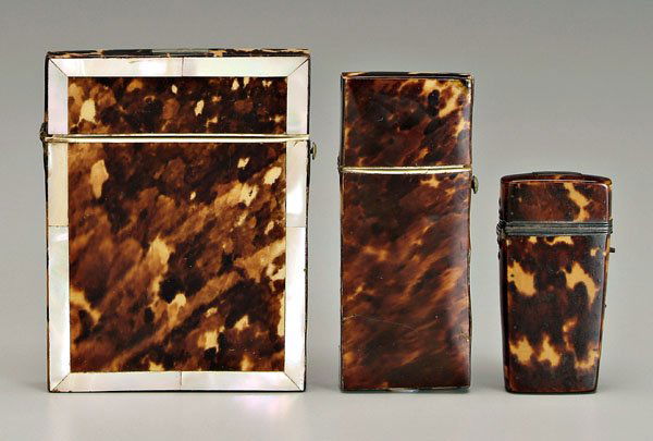 Three tortoise cases: card case with mother-of-pearl borders, 4-1/4 in., [slightly warped;] two needle cases, 2-5/8 in. and 4 in., [cracks and minor losses to tortoise veneer,] all 19th century. Provenance: Private Collect