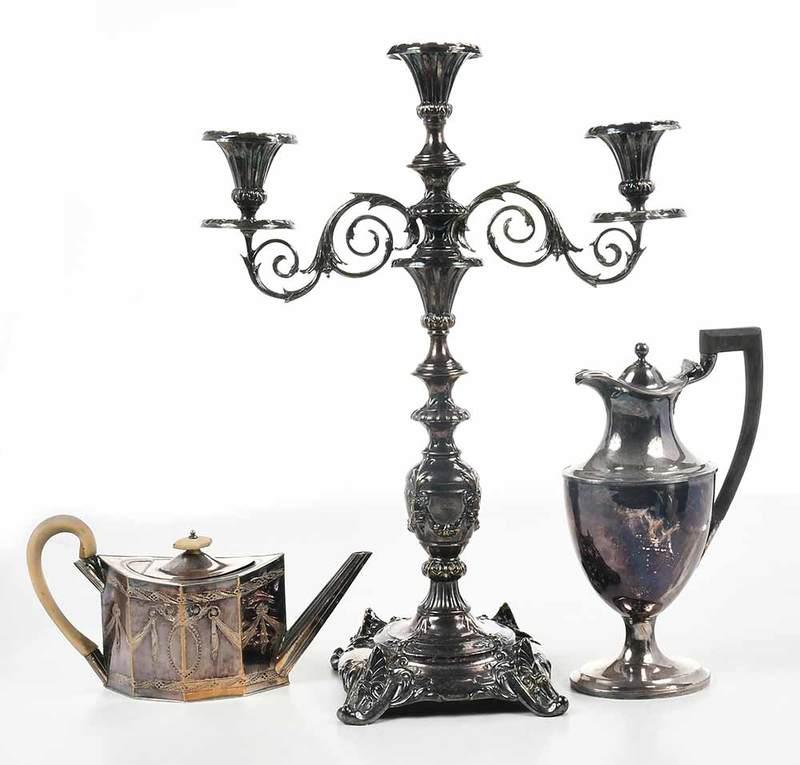 Three Pieces Silver Plate Hollowware: probably 19th century, including Old Sheffield Plate teapot; ewer with wooden handle; two arm candelabra, 6 in. to 21-1/2 in.ÿ - Provenance: Estate of Gail W. Dane, Delray Beach, Florida