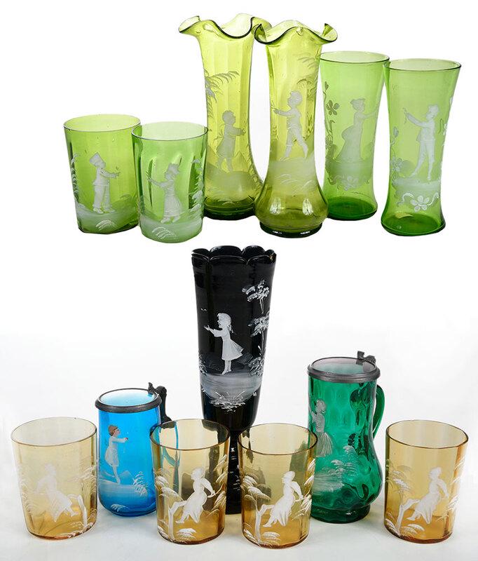 13 Assorted Pieces Mary Gregory Glass: Continental, late 19th/20th century, all with white enameled decoration including four green glass vases; two green glasses; four amber glasses, emerald green covered stein; black glass footed vase, 3