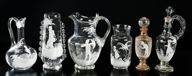 Six Mary Gregory Enameled Glass Vessels: American, late 19th/early 20th century, all with white enamel decoration, including pitcher flared rim and pulled handle; ewer with pulled handle; crackle glass decanter with stopper; cylindrical vase