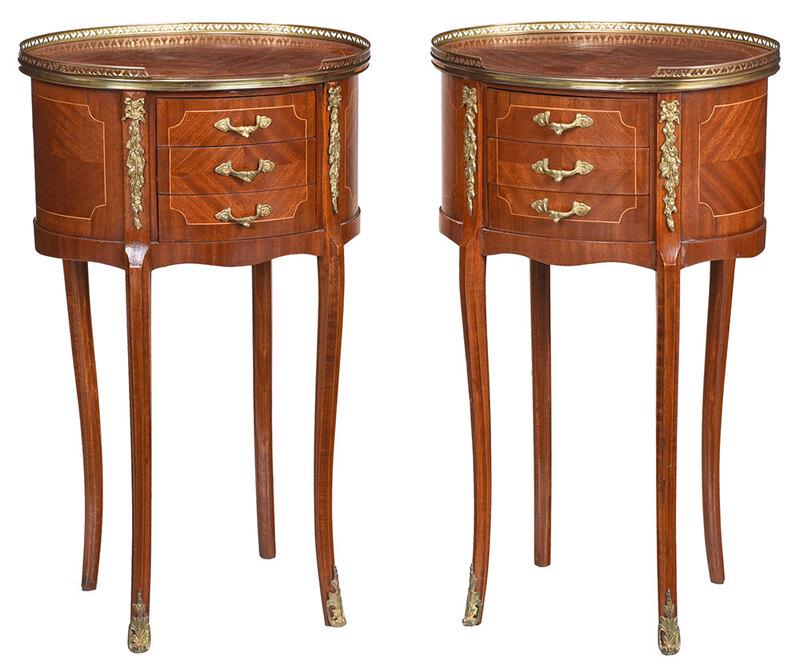 Pair Louis XV Style Brass Mounted Petite Commodes: 20th century, oval tops with brass galleries, over three drawers, bookmatched veneers, brass mounts, 28-1/4 x 17 x 12-1/2 in. - Provenance: Estate of Dr. Joan C. Huntley, Chapel Hill, North Carolina