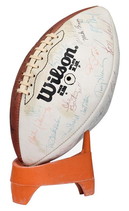 1979 Washington Redskins Signed Football: approximately 40 signatures, players and coaches, on Official Wilson ball with three white panels, in acrylic cube, 11-3/4 in. tallÿNote: Notable signatures include Quarterback Joe Theismann and 