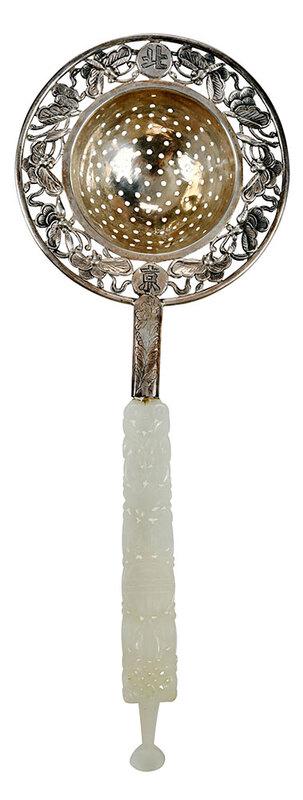 Chinese Silver Tea Strainer with Jade Handle: Republic period, silver bowl with openwork border, marked "China" and Chinese characters for Beijing, mounted to carved openwork white jade handle with shou design, 8-1/2 in. - Provenance: By Descent 