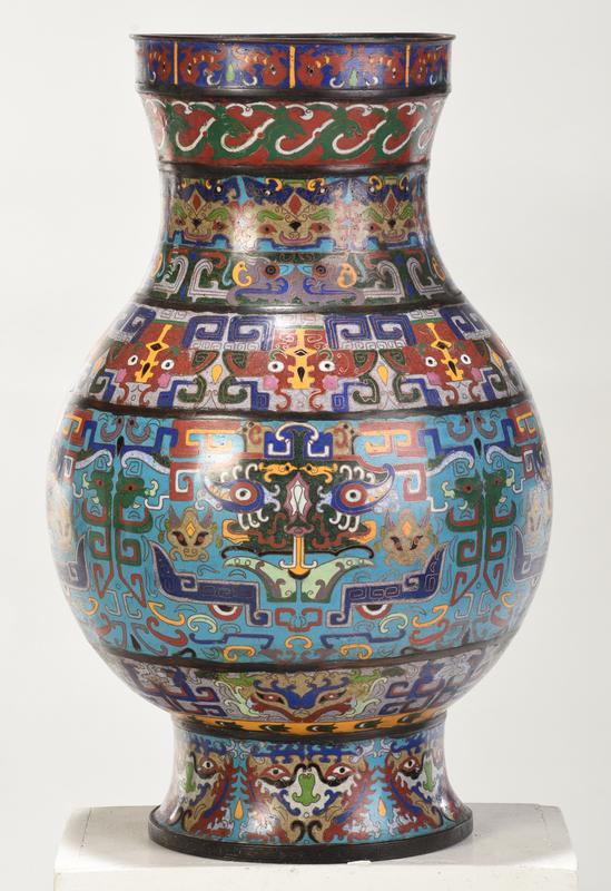 Large Chinese Ming Style Cloisonne Hu Floor Vase: brightly enamel decorated with bands of geometric and abstract animal and human mask motifs throughout, turquoise blue enamel interior, 20 in. - Provenance: Private Collection, Atlanta, Georgia