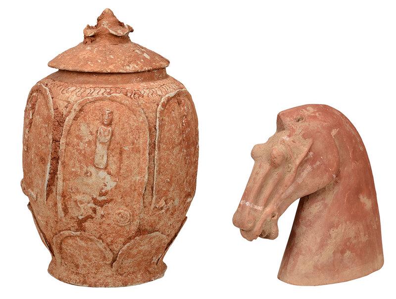 Two Early Chinese Earthenware Pieces: possibly Han dynasty, hollow form horse head with red pigment decoration, 7 in.; unglazed covered jar with applied figures within arched niches, 10-1/2 in. - Provenance: Collection of Russell Chan and