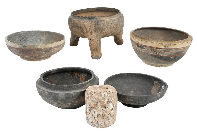 Six Early Chinese Earthenware Vessels: possibly Han dynasty, grey pot on three feet; cylindrical polychrome decorated vessel with small hole at top; two black bowls; two polychrome decorated bowls, largest diameter 9-1/2 in. - Provenance: 