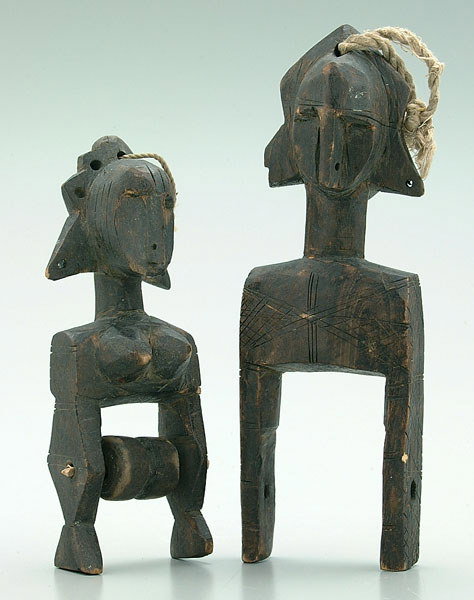 Pair carved African half figures
