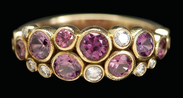 Diamond, ruby ring,: conjoined circles set with eight round faceted rubies, total estimated weight 1.50 cts., seven round brilliant-cut diamonds, total estimated weight .15 cts., 18 kt. yellow gold mount, marks for Alex S