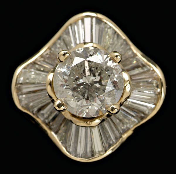 Diamond "ballerina" ring,: central round brilliant-cut diamond, estimated weight 2.25 ct., color I, clarity I2, surrounded by 36 baguette diamonds, total estimated weight 3.0 cts., 18 kt. yellow gold mount, size 5; insurance re