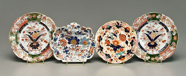 Four ironstone plates,: Imari style decoration: one with orange and pink palette, probably Coalport, 8-7/8 in., [minor rim chip;] one shell shaped, probably Spode, 8-1/8 x 9-1/2 in.; pair shallow bowls with green highlights,