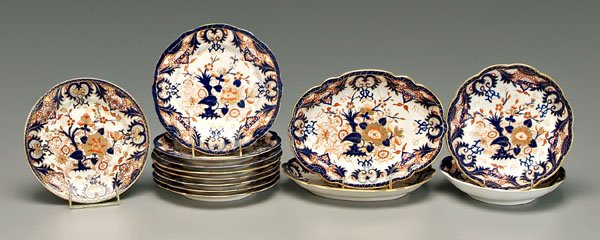 Partial set of Derby ironstone,: cobalt and iron red Imari style decoration with extensive gilt highlights, all with orange crown over Gothic "D", British, early 19th century, (13 pieces). Provenance: Kentucky Private Collection. Det