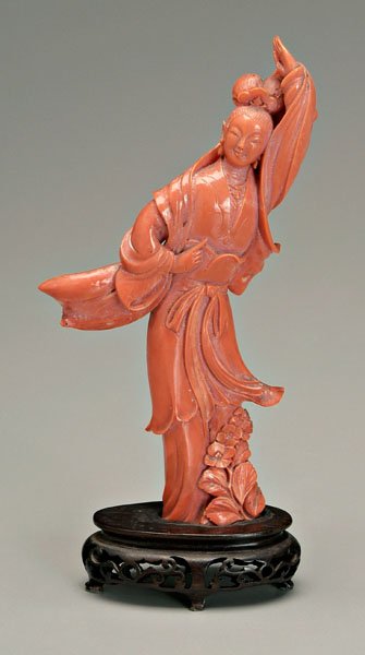 Chinese carved coral figure,: smiling lady performing a dance, a scarf swirling around her arms and head, 19th century, 6 in., 7 in. on fitted wood stand. Minor chips to fingers on left hand, minor loss to tip of sash, glued to wo