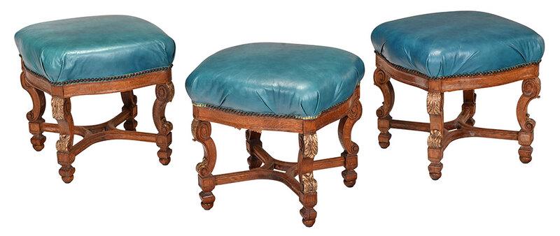 Suite of Three Louis XIV Style Footstools: 20th century, each with bright blue green leather upholstered seat with brass tacking, on carved oak frames with gold highlights, 19 x 19 x 19 in. - Provenance: Estate of Paul W. Doll, Jr., Lake Toxaw