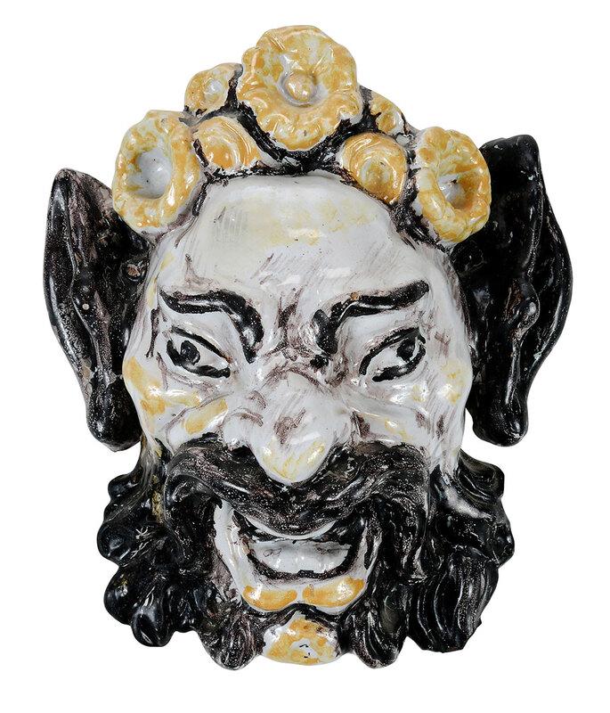 Majolica Wall Mask of Bearded Face: Continental, possibly 17th century, laughing face with full mustache and beard, applied flowers in hair, possibly of Bacchus or a Satyr, unsigned, with interior wire for hanging, 12 in. - Provenance: 