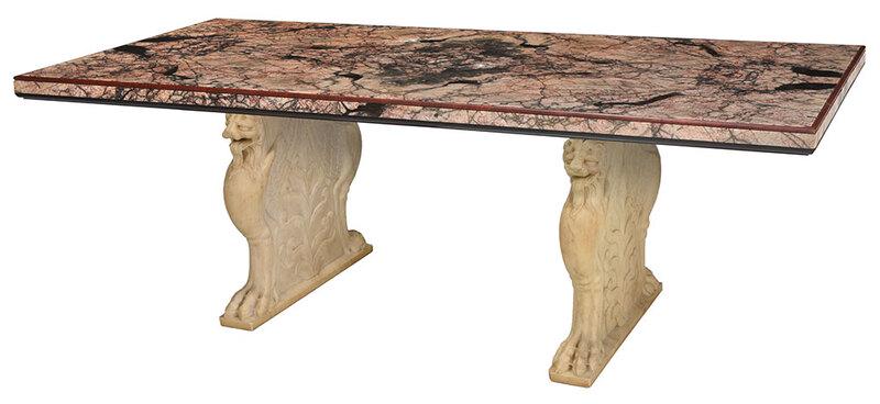 Fine Renaissance Style Carved Marble Dining Table: Italian, 19th/20th century, with salmon to black variegated marble top with rouge marble molded edges, ebonized wooden lower molding, marble veneers, resting on two winged griffin form white marble su