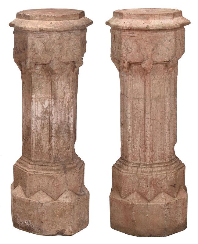 Pair Gothic Style Stone Pedestals: age unknown, probably 19th century, appear to be cast stone with traces of red surface, hollow forms with capped tops, octagonal forms with tracery decorations, 44 x 15-1/2 x 15-1/2 in. - Provenance: 