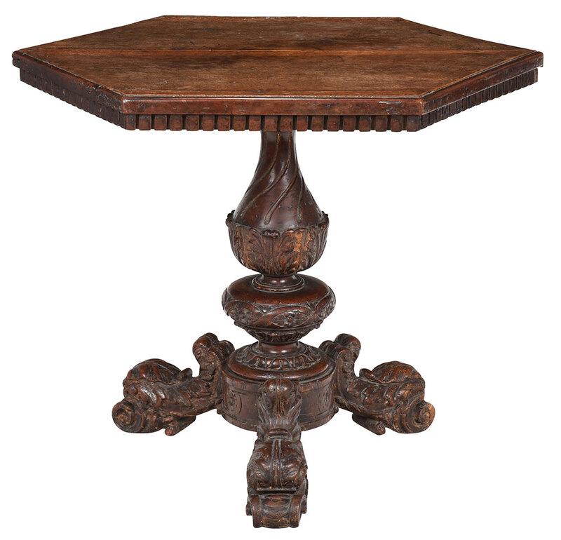 Italian Baroque Carved Walnut Pedestal Table: Continental, probably 17th century, with thick two board walnut top with castellated molding, on turned and leaf carved support with tripod base and leaf carved legs with scroll feet, some traces of e