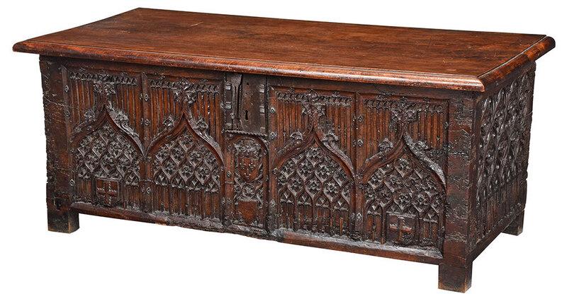 Fine Gothic Tracery Carved Iron Mounted Coffer: French or possibly Flanders, 15th/16th century elements, heavy hinged lid and open interior, early iron lock with figural hasp, tracery carved front and side panels, front centering a heraldic crest w