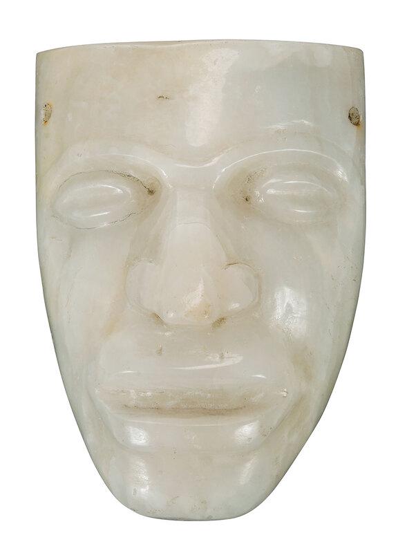 Mayan Style Carved Onyx Mask: age unknown, two drilled holes to each side of forehead, several old adhesive labels including Christie's on back, 7-1/4 x 5-1/4 in.Ã¿ - Provenance: Christie's (attached label); Estate of Paul W. Do