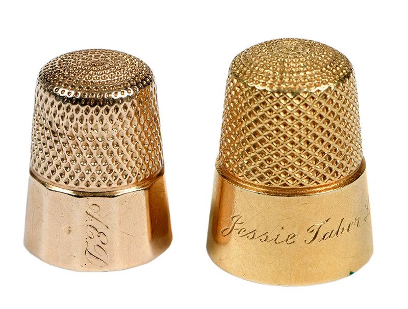 Two Antique Gold Thimbles: one engraved with full name, stamped "9, 18K", yellow gold, 7/8 x 11/16 in. at widest, 11.5 grams; engraved with initials, stamped "7, 14K", yellow gold, 13/16 x 5/8 in. at widest, 6.0 gramsÿ - Prove