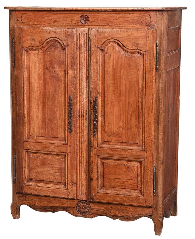 Provincial Louis XV Carved and Paneled Cabinet: French, 18th century, double paneled doors set with steel escutcheons and hinges, floral carved crest and skirt, 61-1/2 x 47-1/4 x 22-1/2 in. - Provenance: Collection of Dr. Joseph T. and Gaile E. Win