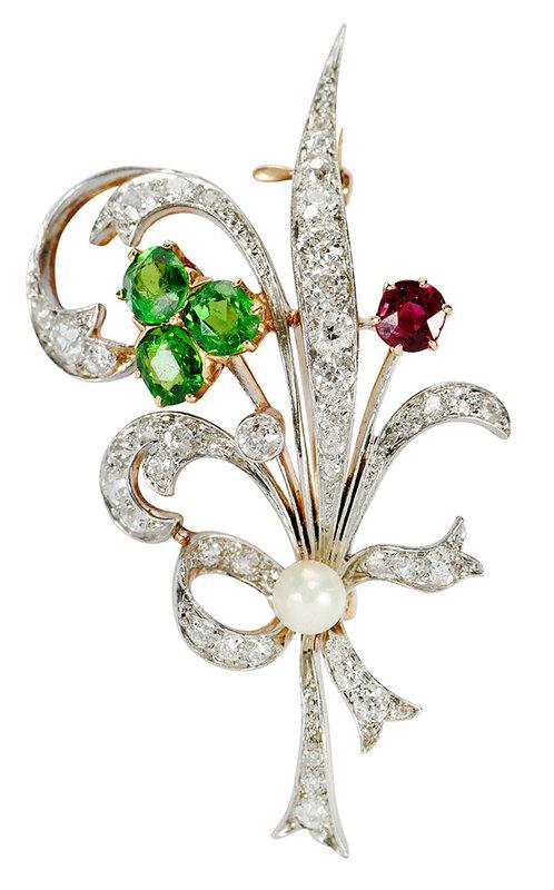 Antique Platinum Topped Gold Gemstone Brooch: three oval faceted green stones, possibly tsavorite garnet, approx. 4.5 x 4mm each, one cushion shaped faceted ruby approx. 4 x 3.8mm, one pearl approx. 4.3mm, approx. 43 old European cut diamonds est
